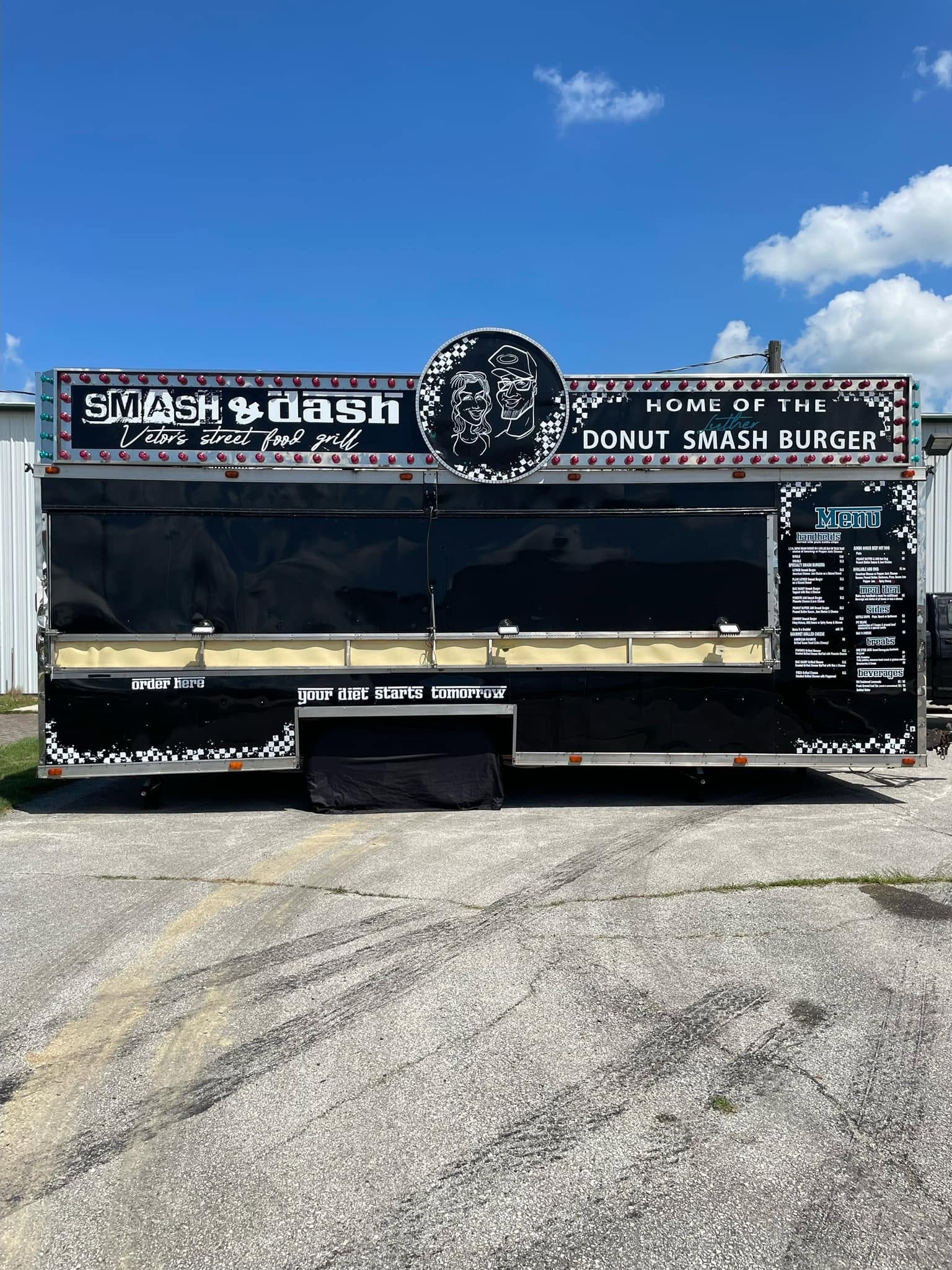 The Smash & Dash truck set up at a daytime event