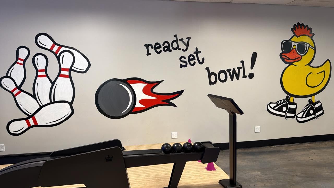 The duckpin lanes and 'ready, set, bowl!' mural