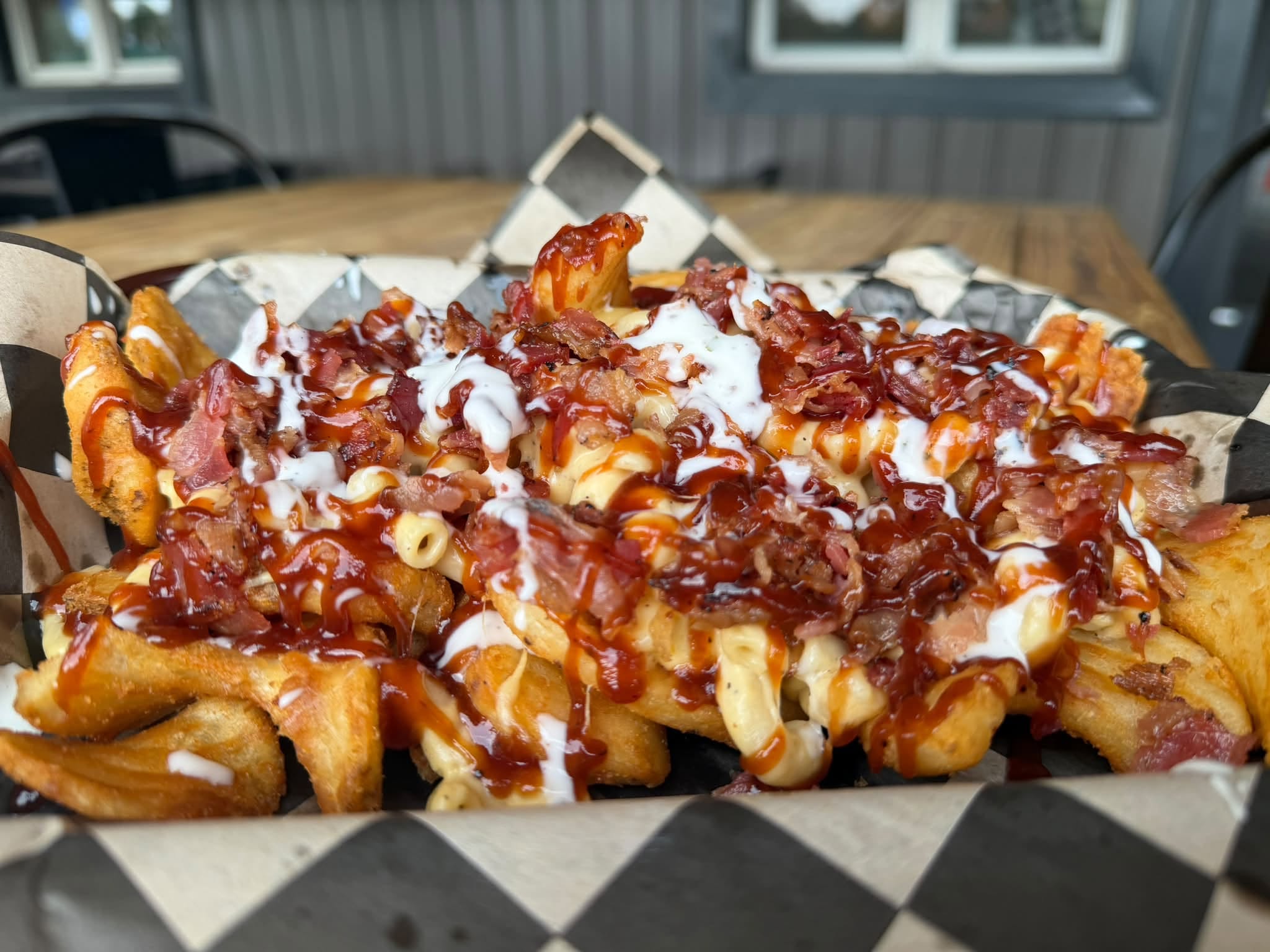 BBQ Bacon Mac Fries — waffle fries loaded with mac n cheese, bacon, BBQ and ranch